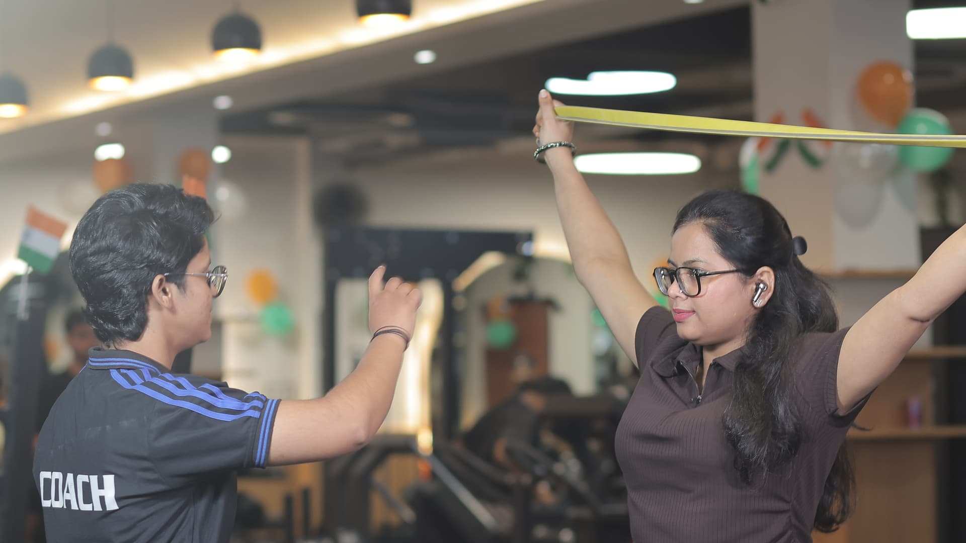 A Bludgeon coach guiding a member through a lift